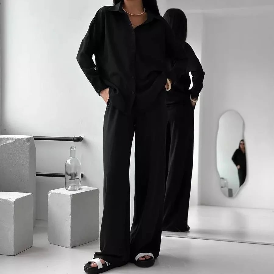 Elegant feminine set consisting of shirt and trousers